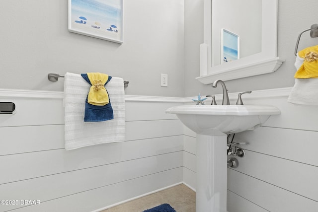 4210 S Peninsula Dr, Port Orange, FL 32127 - bathroom with a wainscoted wall