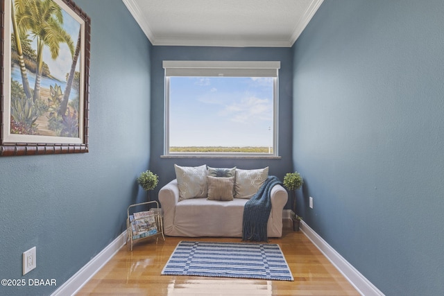 4210 S Peninsula Dr, Port Orange, FL 32127 - sitting room featuring wood finished floors, baseboards, and crown molding