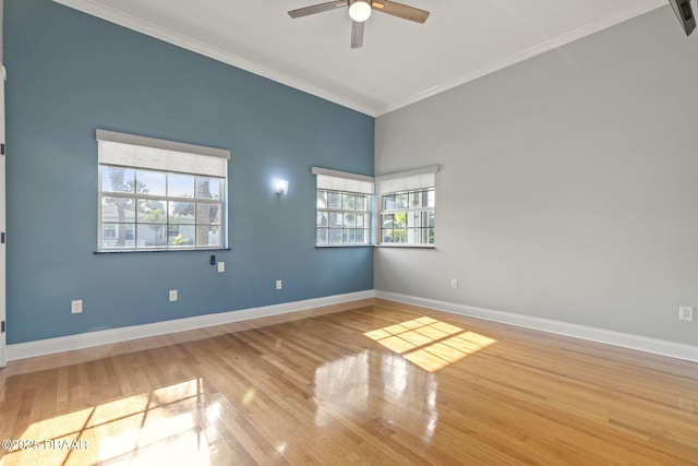 4210 S Peninsula Dr, Port Orange, FL 32127 - empty room featuring ornamental molding, a ceiling fan, baseboards, and wood finished floors
