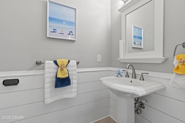 4210 S Peninsula Dr, Port Orange, FL 32127 - bathroom with a wainscoted wall
