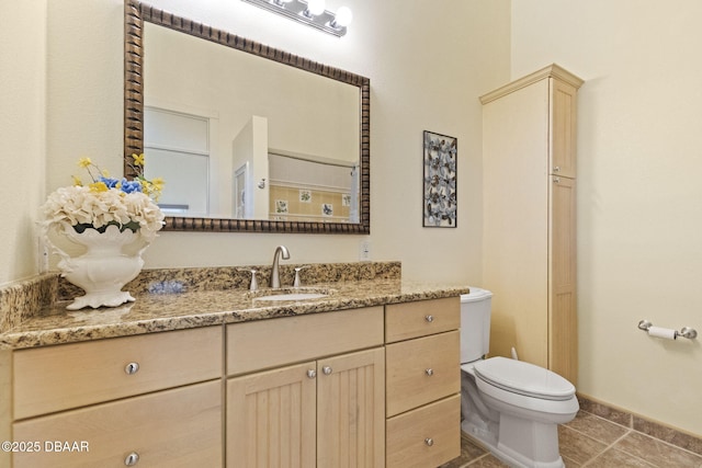 4210 S Peninsula Dr, Port Orange, FL 32127 - bathroom with vanity, toilet, tile patterned floors, and baseboards