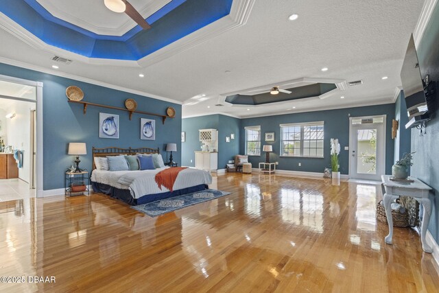 4210 S Peninsula Dr, Port Orange, FL 32127 - bedroom featuring a raised ceiling, wood-type flooring, crown molding, recessed lighting, and baseboards