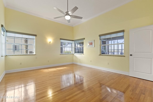 4210 S Peninsula Dr, Port Orange, FL 32127 - spare room featuring ornamental molding, wood finished floors, ceiling fan, and baseboards