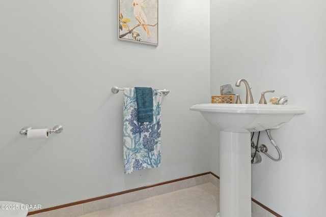 4210 S Peninsula Dr, Port Orange, FL 32127 - bathroom with tile patterned floors and a sink