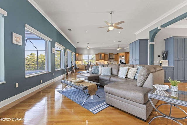 4210 S Peninsula Dr, Port Orange, FL 32127 - living area with crown molding, a ceiling fan, light wood finished floors, baseboards, and recessed lighting