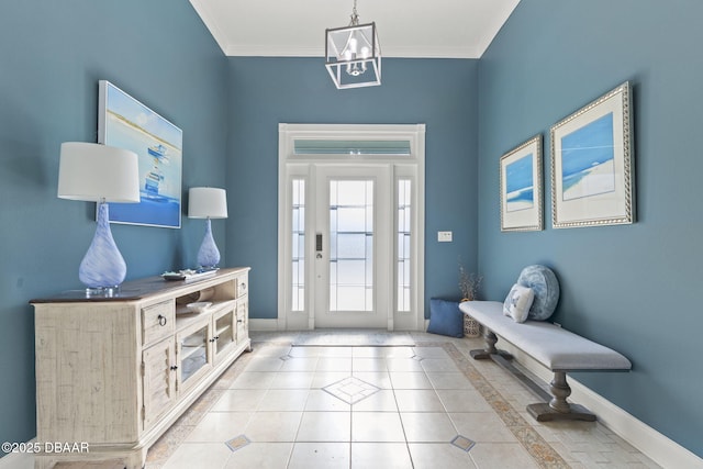 4210 S Peninsula Dr, Port Orange, FL 32127 - tiled foyer with baseboards, a chandelier, and ornamental molding