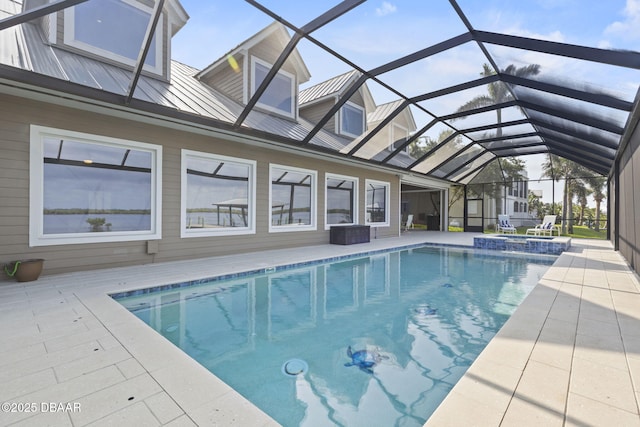 4210 S Peninsula Dr, Port Orange, FL 32127 - view of swimming pool with a patio area, a pool with connected hot tub, and glass enclosure