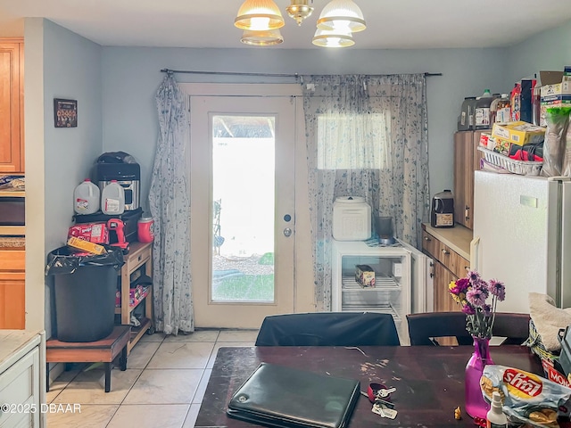 3422 Victory Palm Dr, Edgewater, FL 32141 - dining room with light tile patterned floors and a chandelier