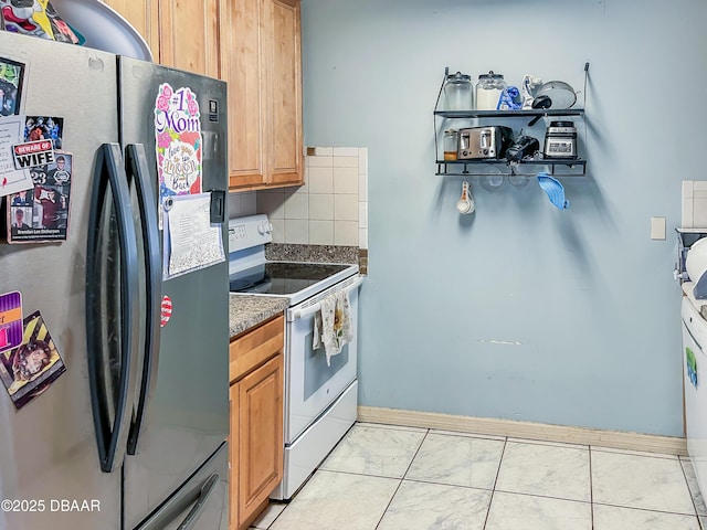 3422 Victory Palm Dr, Edgewater, FL 32141 - kitchen featuring freestanding refrigerator, electric stove, tasteful backsplash, baseboards, and light marble finish floors