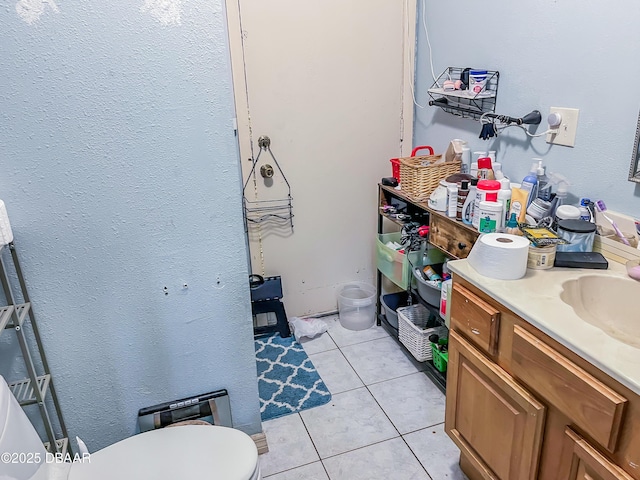 3422 Victory Palm Dr, Edgewater, FL 32141 - bathroom with vanity, tile patterned floors, toilet, and a textured wall