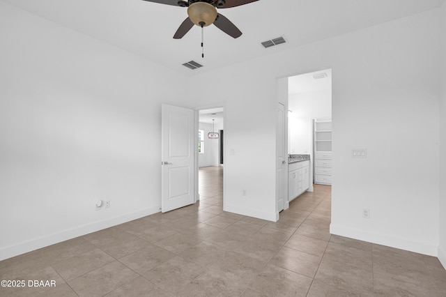 623 Margaritaville Ave, Daytona Beach, FL 32124 - unfurnished bedroom featuring light tile patterned flooring and baseboards