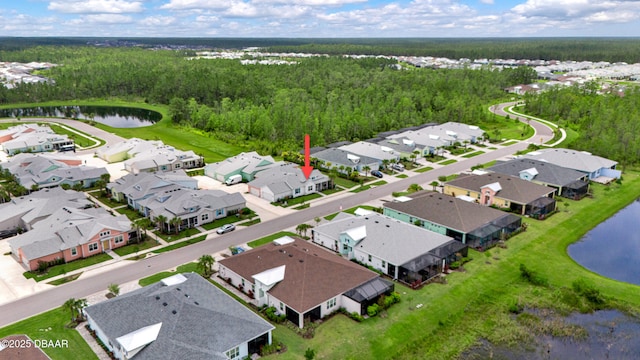 623 Margaritaville Ave, Daytona Beach, FL 32124 - aerial perspective of suburban area with a nearby body of water and a heavily wooded area