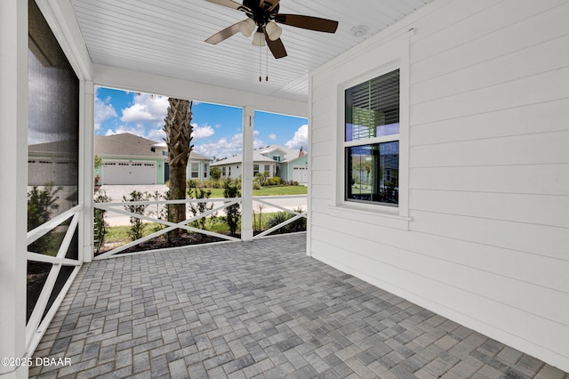 623 Margaritaville Ave, Daytona Beach, FL 32124 - unfurnished sunroom featuring a ceiling fan and a residential view
