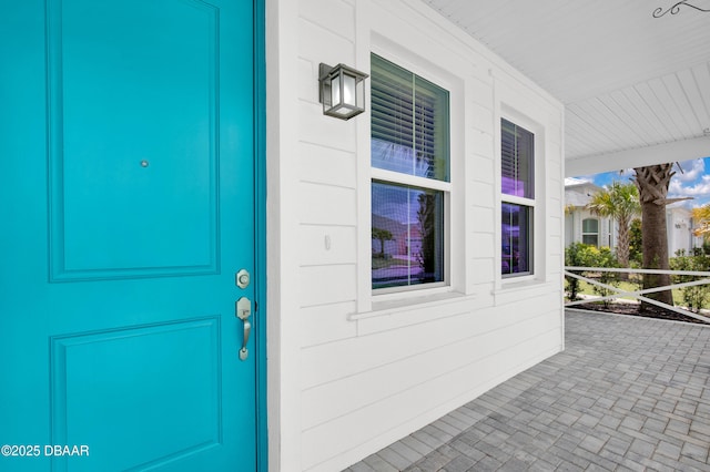 623 Margaritaville Ave, Daytona Beach, FL 32124 - doorway to property featuring covered porch