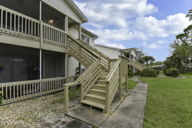 exterior space with a yard and stairway