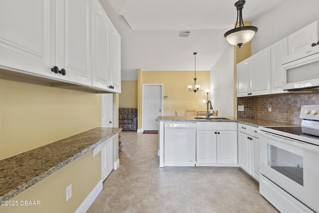 kitchen with decorative light fixtures, white cabinetry, white appliances, and sink