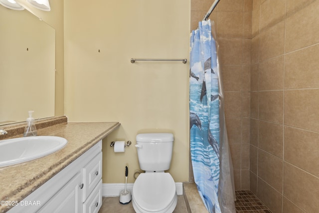 bathroom with tile patterned floors, vanity, toilet, and walk in shower