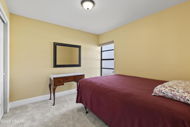 bedroom featuring light carpet