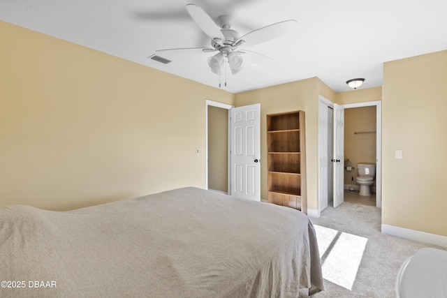 unfurnished bedroom featuring ensuite bathroom, a closet, ceiling fan, and light colored carpet