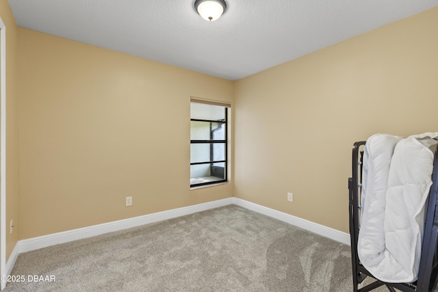 unfurnished bedroom with light colored carpet