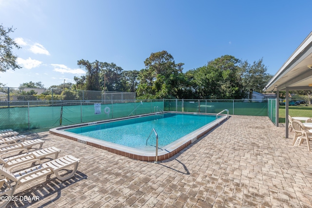 view of swimming pool featuring a patio