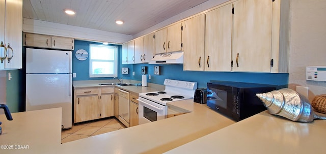 kitchen with light brown cabinets, under cabinet range hood, white appliances, light countertops, and light tile patterned floors