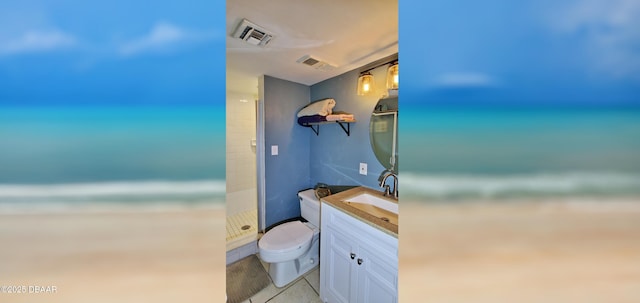 full bathroom featuring vanity, a shower stall, toilet, and visible vents