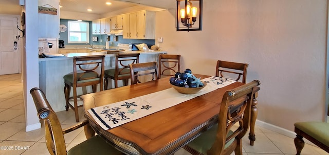 dining area featuring light tile patterned floors, recessed lighting, and baseboards