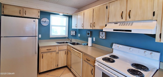 kitchen with white appliances, light brown cabinets, range hood, and a sink