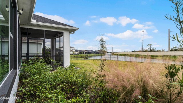 view of yard featuring a sunroom