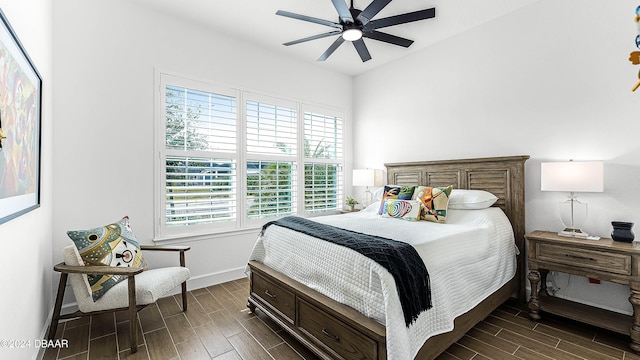 bedroom featuring ceiling fan and dark hardwood / wood-style flooring