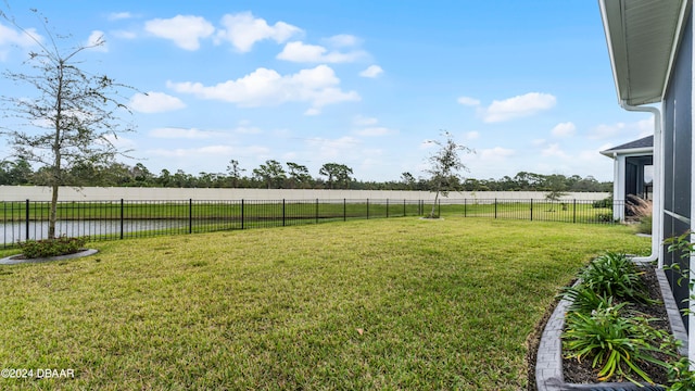 view of yard featuring a rural view and a water view