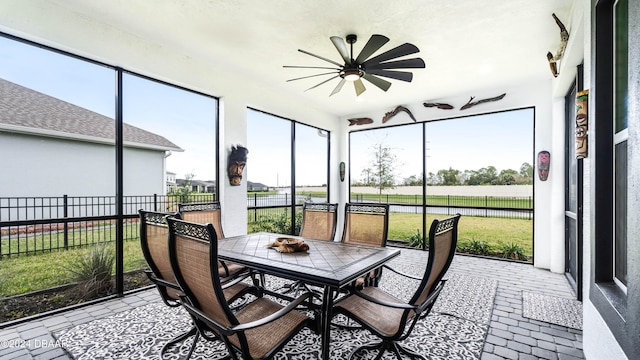 sunroom / solarium with ceiling fan