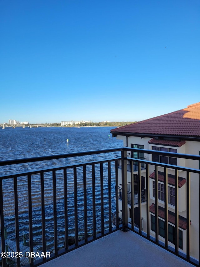 balcony featuring a water view