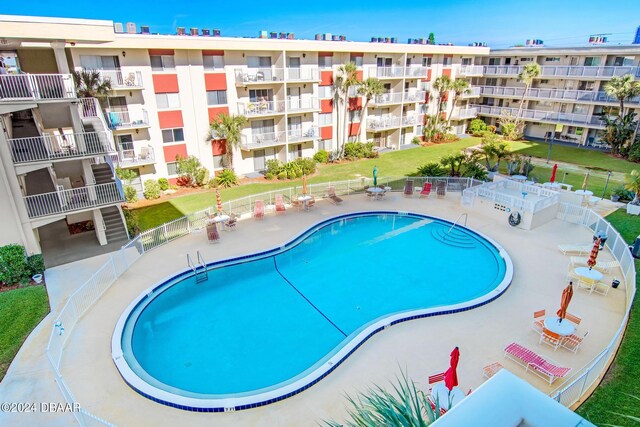 view of pool featuring a patio