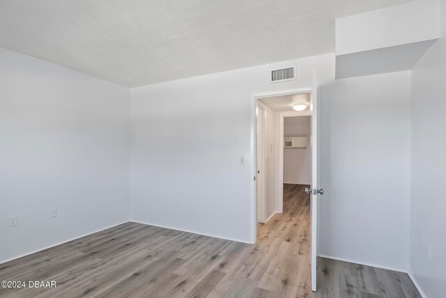 empty room with light wood-type flooring