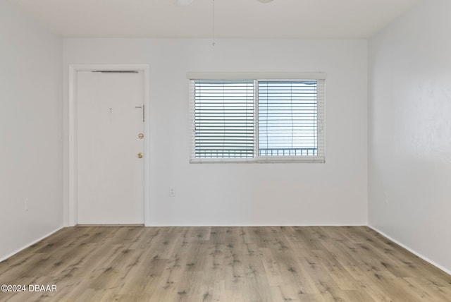 spare room featuring light hardwood / wood-style flooring