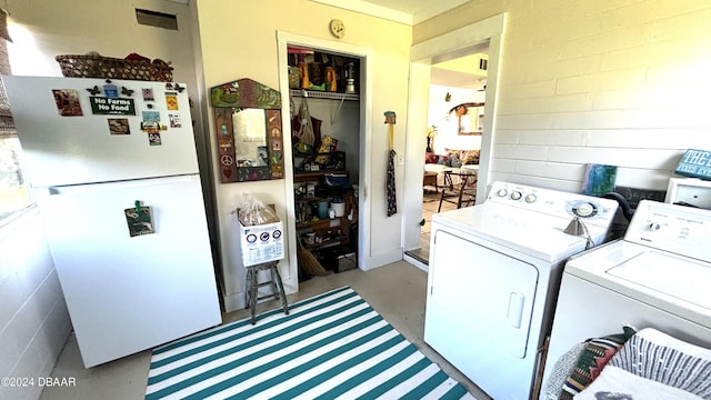 washroom with washer and clothes dryer