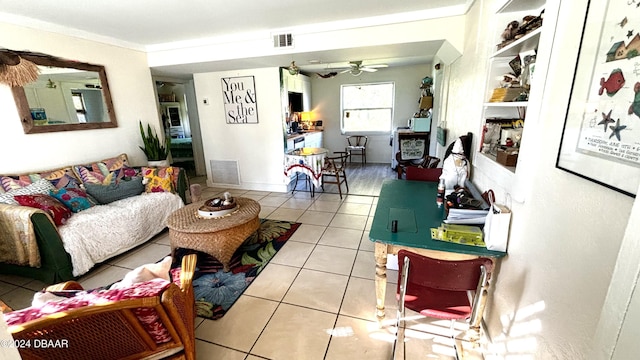 tiled living room featuring ceiling fan