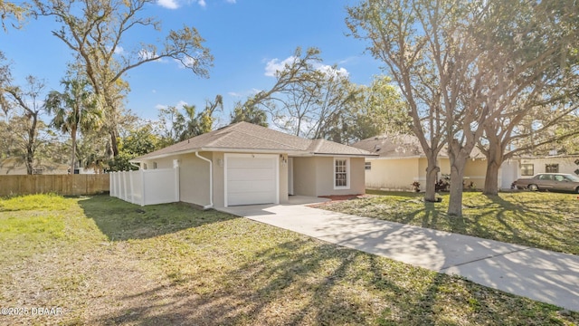 single story home featuring a front lawn, fence, stucco siding, a garage, and driveway