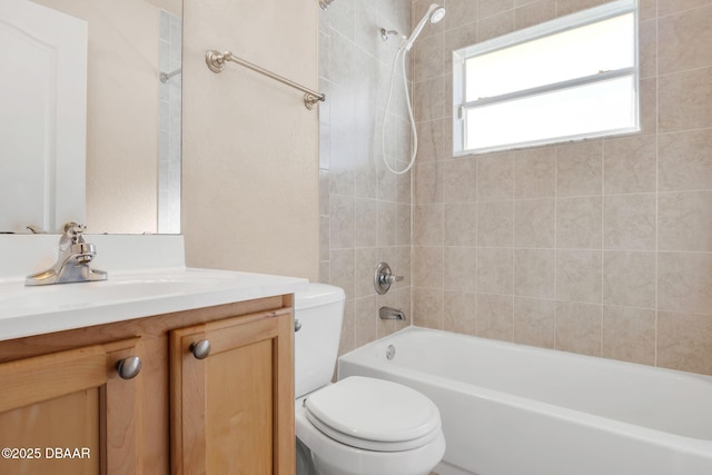 bathroom with vanity, toilet, and washtub / shower combination