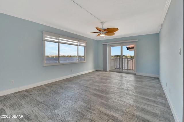 spare room with ceiling fan, light hardwood / wood-style flooring, and ornamental molding