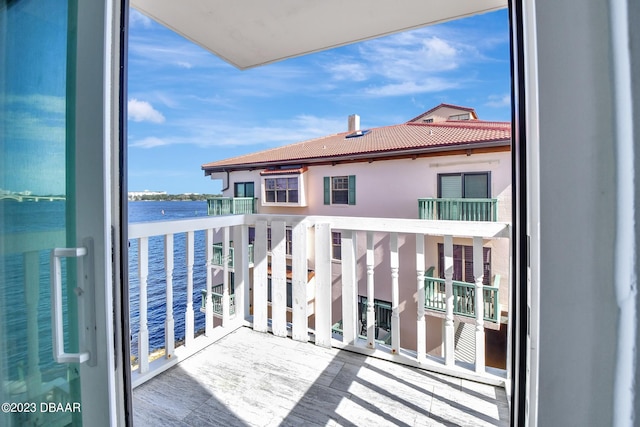 balcony featuring a water view