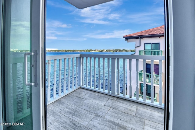 balcony featuring a water view