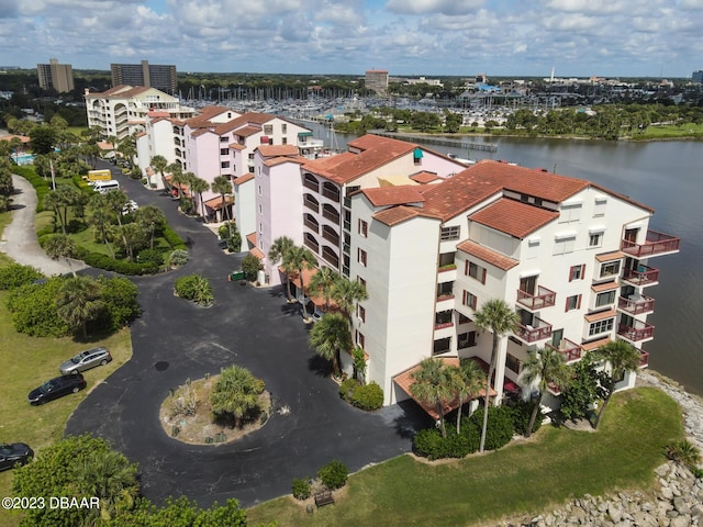 birds eye view of property with a water view