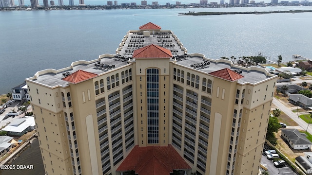 birds eye view of property featuring a city view and a water view