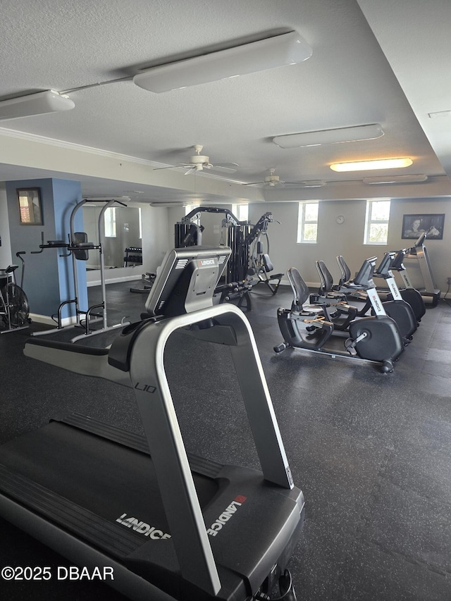 exercise room featuring ceiling fan and a textured ceiling