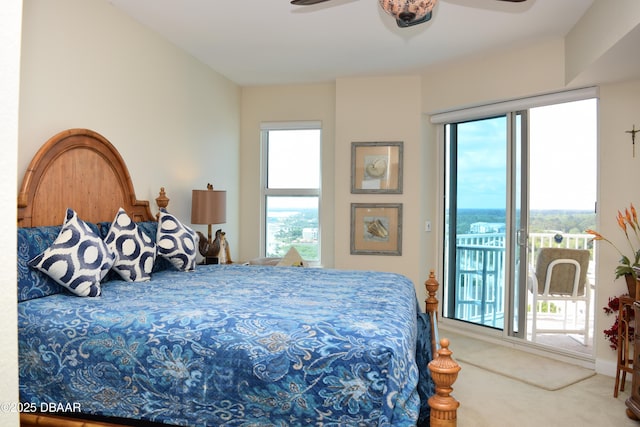 carpeted bedroom with access to outside and ceiling fan