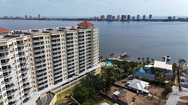 drone / aerial view with a city view and a water view