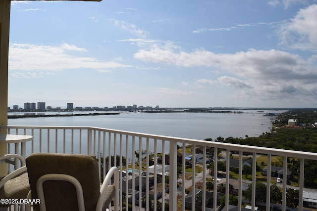 balcony featuring a water view and a view of city